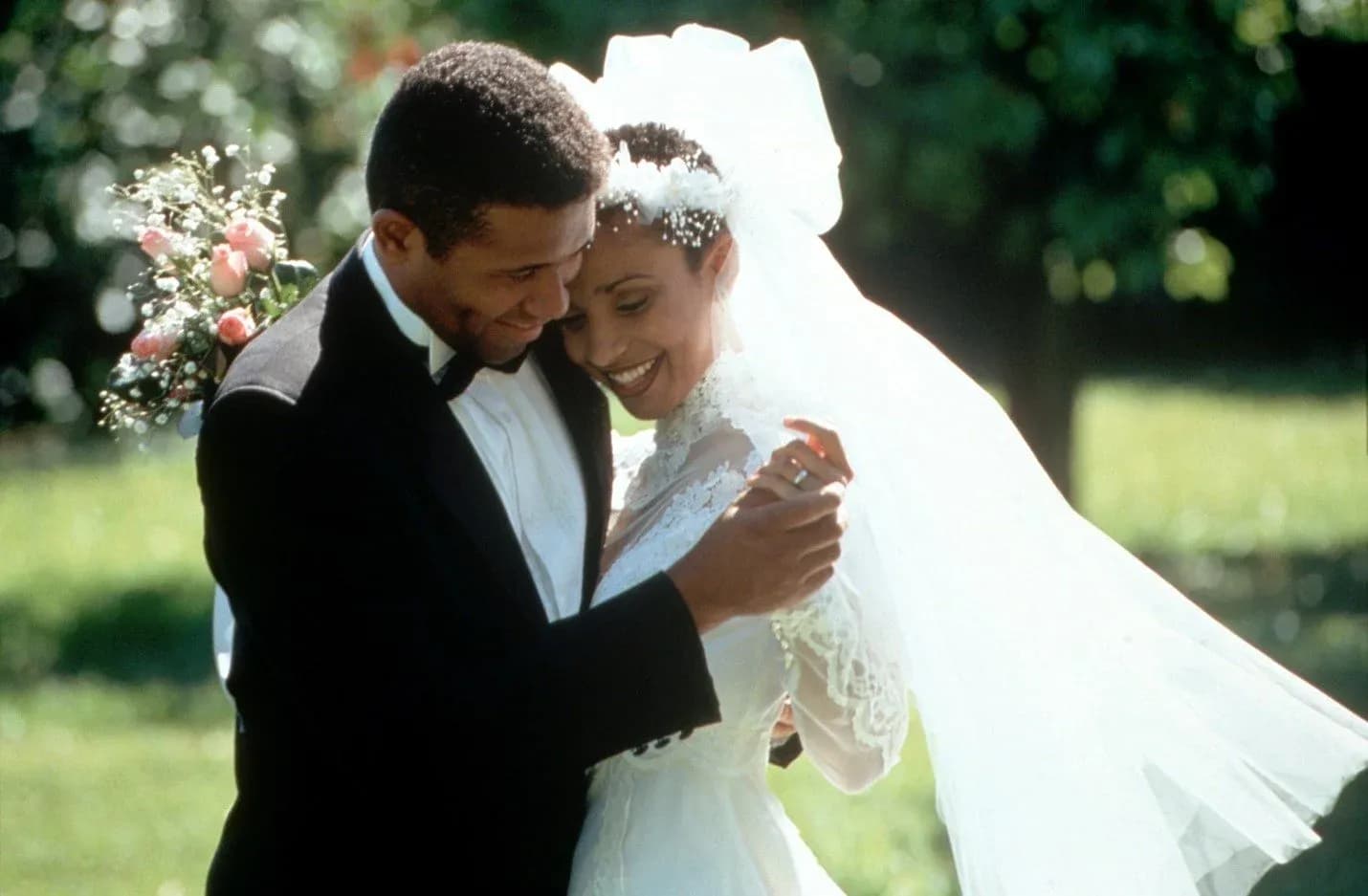 Newly Married couple at a wedding, hugging